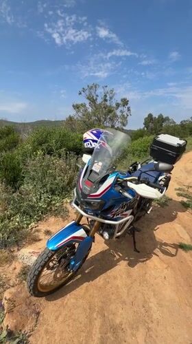 Motorcycle and fire pit documented in Tangier countryside