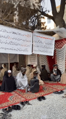 Traditional outdoor gathering of elderly men documented in Quetta