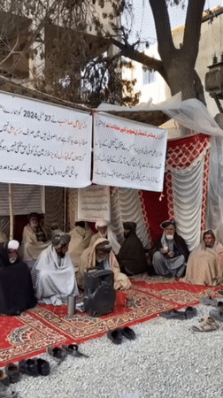 Traditional outdoor gathering of elderly men documented in Quetta