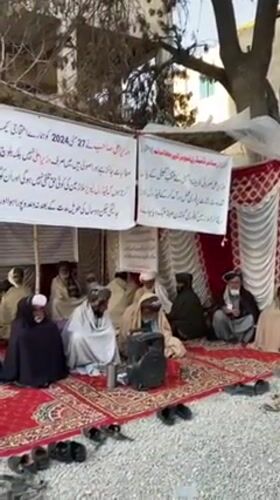 Traditional outdoor gathering of elderly men documented in Quetta