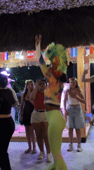 Carnival dancers and live music at a Boreti outdoor venue