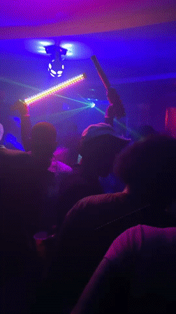 Late night club scene with dancing and live percussion in Guzape