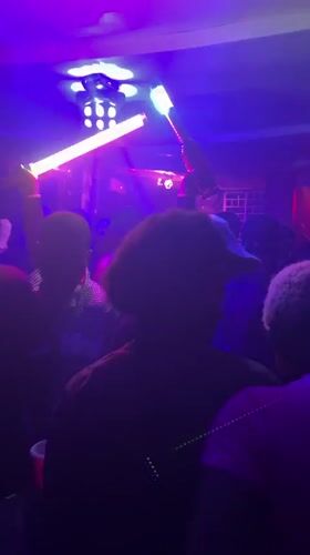 Late night club scene with dancing and live percussion in Guzape
