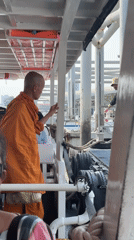Buddhist monk observed at Bangkok's Wat Arun temple pier