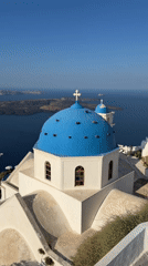 Blue-domed church against the Aegean in Santorini