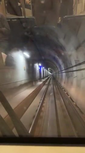 Train journey through illuminated tunnel in Coquitlam