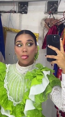Mirror selfies in folkloric costume, Porlamar dressing room