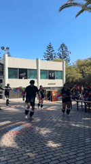 Young dancers perform synchronized routine outdoors in Arica Chile