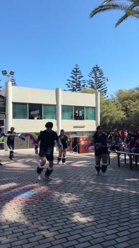 Young dancers perform synchronized routine outdoors in Arica Chile