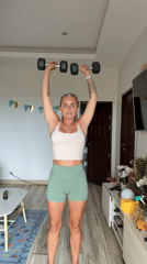 Home workout session in a Ko Samui apartment, dumbbells included.