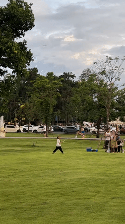 Dog owners and their pups hang out at a Chang Phueak park