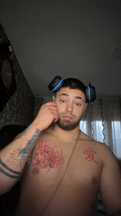 Man with headphones and tattoos photographed in Grashevo