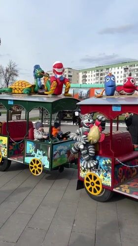 Children's train and skateboarding activities captured in Ufa park