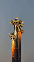 Evening scenes captured around Beijing's illuminated Olympic Tower area