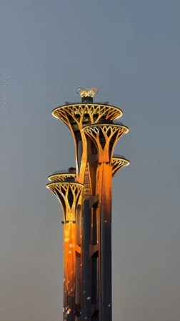 Evening scenes captured around Beijing's illuminated Olympic Tower area