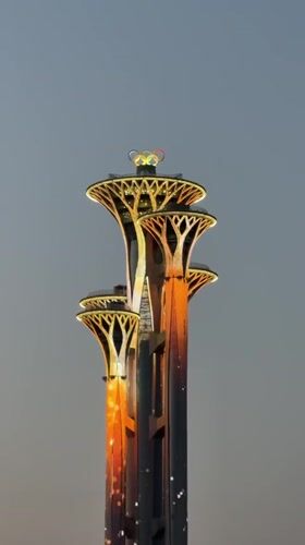 Evening scenes captured around Beijing's illuminated Olympic Tower area