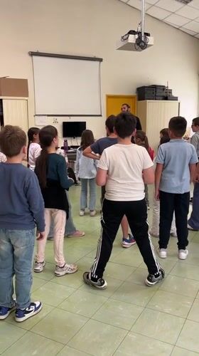 Children attend singing and drawing lessons in La Fouillouse school