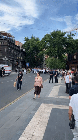 Crowd marches through central Yerevan in white shirts