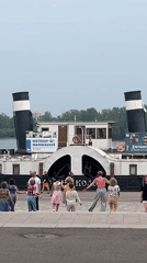 Crowd on the steps of a classic paddle steamer, Krasnoyarsk