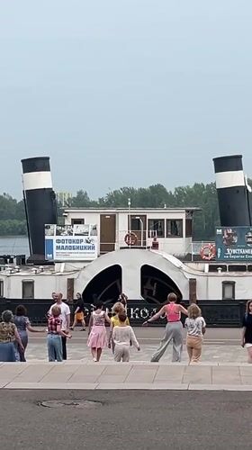 Crowd on the steps of a classic paddle steamer, Krasnoyarsk