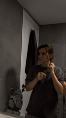 Woman captured in mirror reflection in Limassol, Cyprus