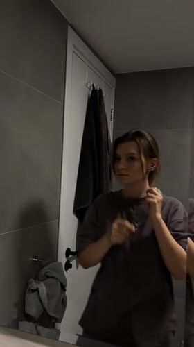 Woman captured in mirror reflection in Limassol, Cyprus