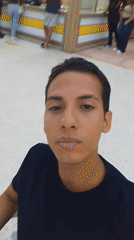 Young man films himself in Porlamar shopping mall