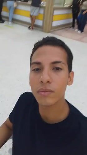 Young man films himself in Porlamar shopping mall