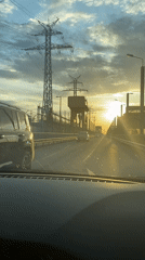 Driver captures sunset view through industrial landscape in Chaikovsky
