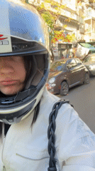 Motorcyclist rides through sunny Buenos Aires streets