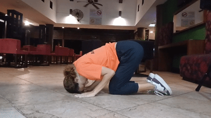 Woman exercises, takes selfies in Venezuelan beach resort lobby