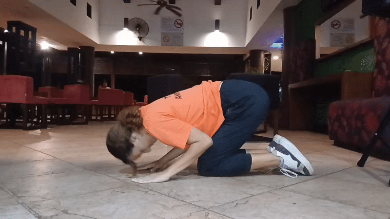Woman exercises, takes selfies in Venezuelan beach resort lobby