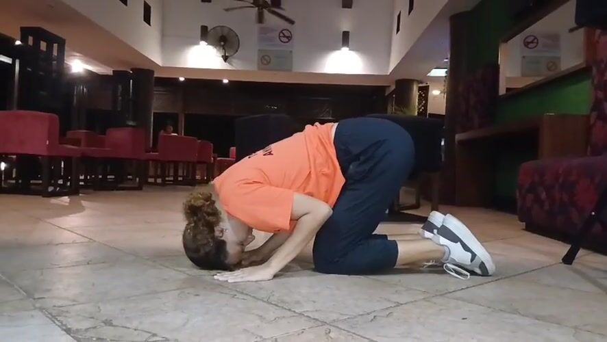 Woman exercises, takes selfies in Venezuelan beach resort lobby