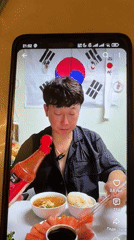 Korean food spread in Semey, with a restaurant promo card