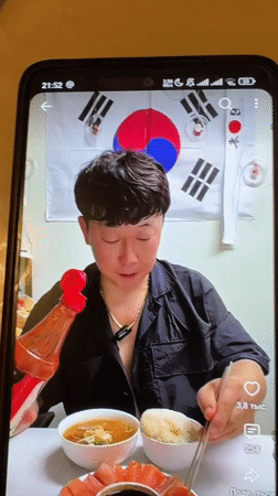 Korean food spread in Semey, with a restaurant promo card