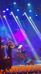Musical ensemble performs with colorful stage lighting in Ukraine