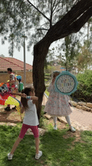 Children celebrate with piñata game at Netanya park birthday party