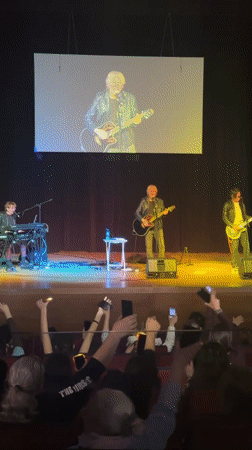 Three-piece band performs live in Sliven, Bulgaria auditorium