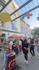 Outdoor market fair draws crowds with vendors and decorations