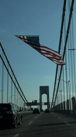 Fourth of July drive across a flag-lined New York bridge