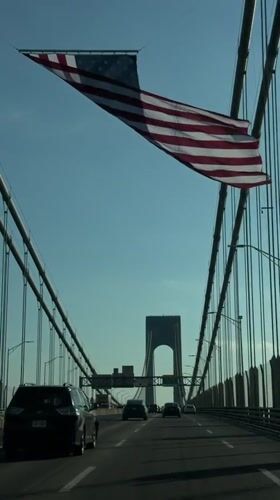 Fourth of July drive across a flag-lined New York bridge