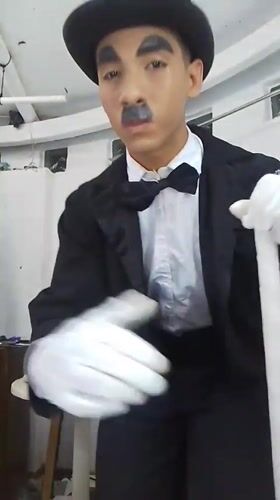 Chaplin and Monroe impersonators pose backstage in Porlamar