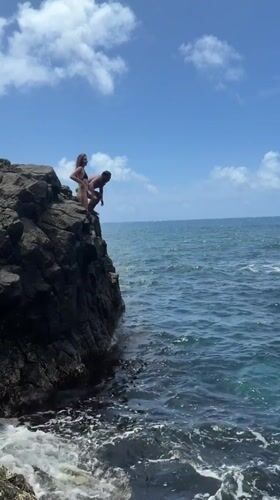Couple cliff diving at Philippine coast captured by witness