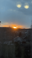Sunset observed through window in suburban Chaikovsky, Russia