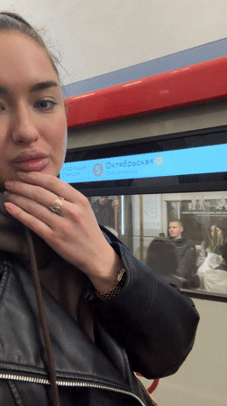 Woman documents evening Metro commute at Moscow's Oktyabrskaya station