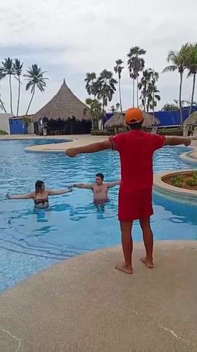 Water aerobics session documented at Venezuelan beach resort