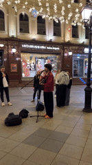 Street musician performs guitar set on Moscow pedestrian mall