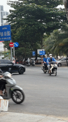 Urban street life captured across tropical city location