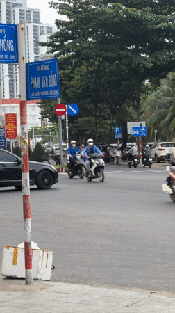 Urban street life captured across tropical city location