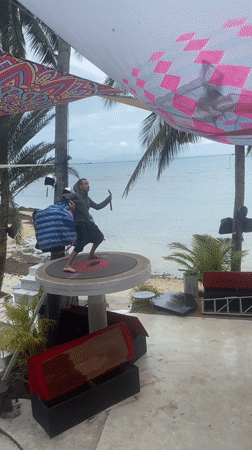 Man performs nunchuck routine on platform in Ban Haad Rin